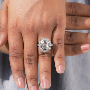 View of Oval Cut Moissanite Halo Engagement Ring In finger