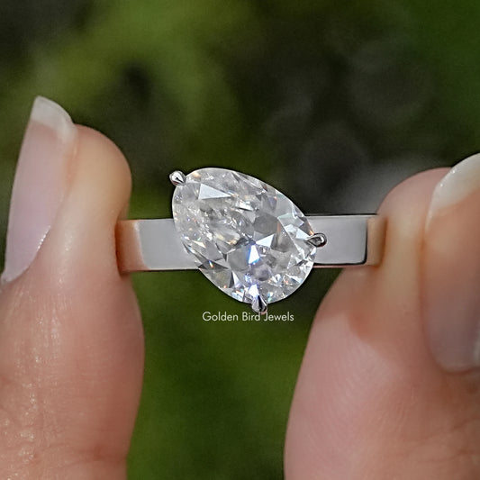 925 sterling silver solitaire ring with a large pear-cut moissanite stone