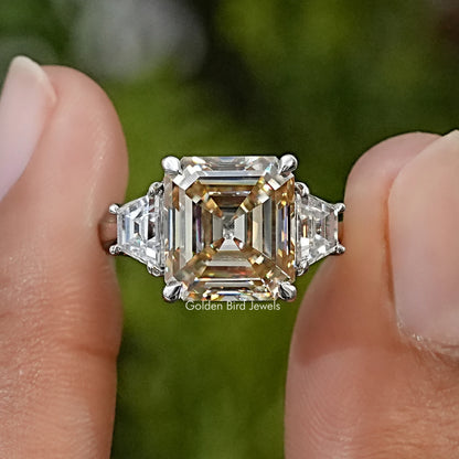 Sterling silver three-stone engagement ring with Asscher-cut center moissanite and triangular side stones