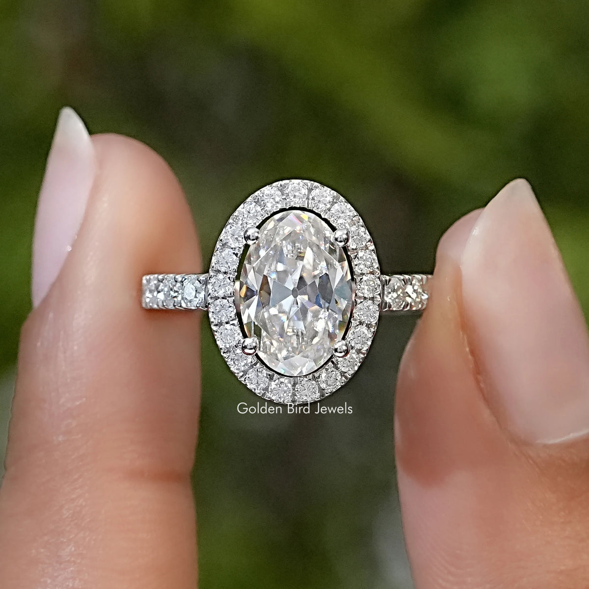Oval cut moissanite halo solitaire ring in sterling silver