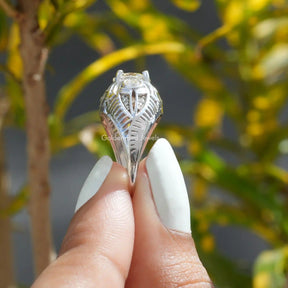 Side View of Round Cut Moissanite Vintage Ring In two fingers