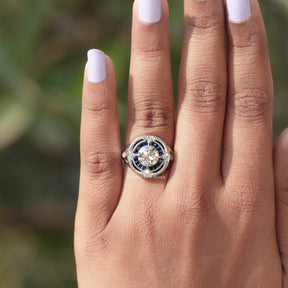 View of Round Cut And Tapper Baguette Halo Ring In finger