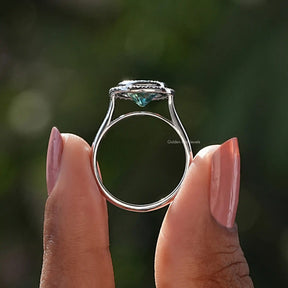 Back View of Round Cut Bezel Set Moissanite Ring In two fingers