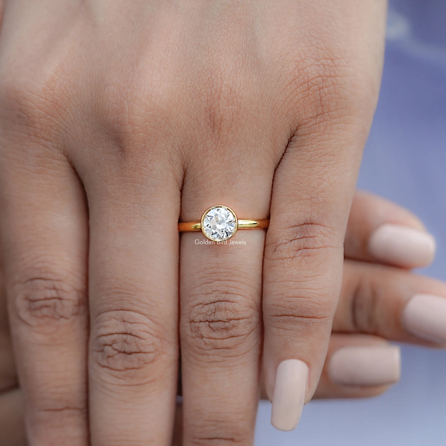 View of Round Cut Solitaire Engagement Ring in prongs setting 