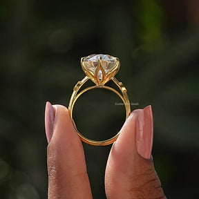 Back View of Round Cut Moissanite Ring In two fingers