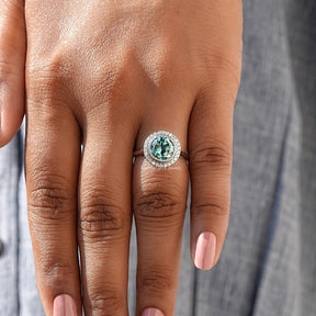 Blue Round Cut Moissanite Halo Ring In finger