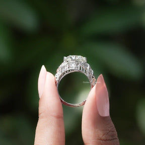 Back View of Old European Round Cut Moissanite Ring In two fingers