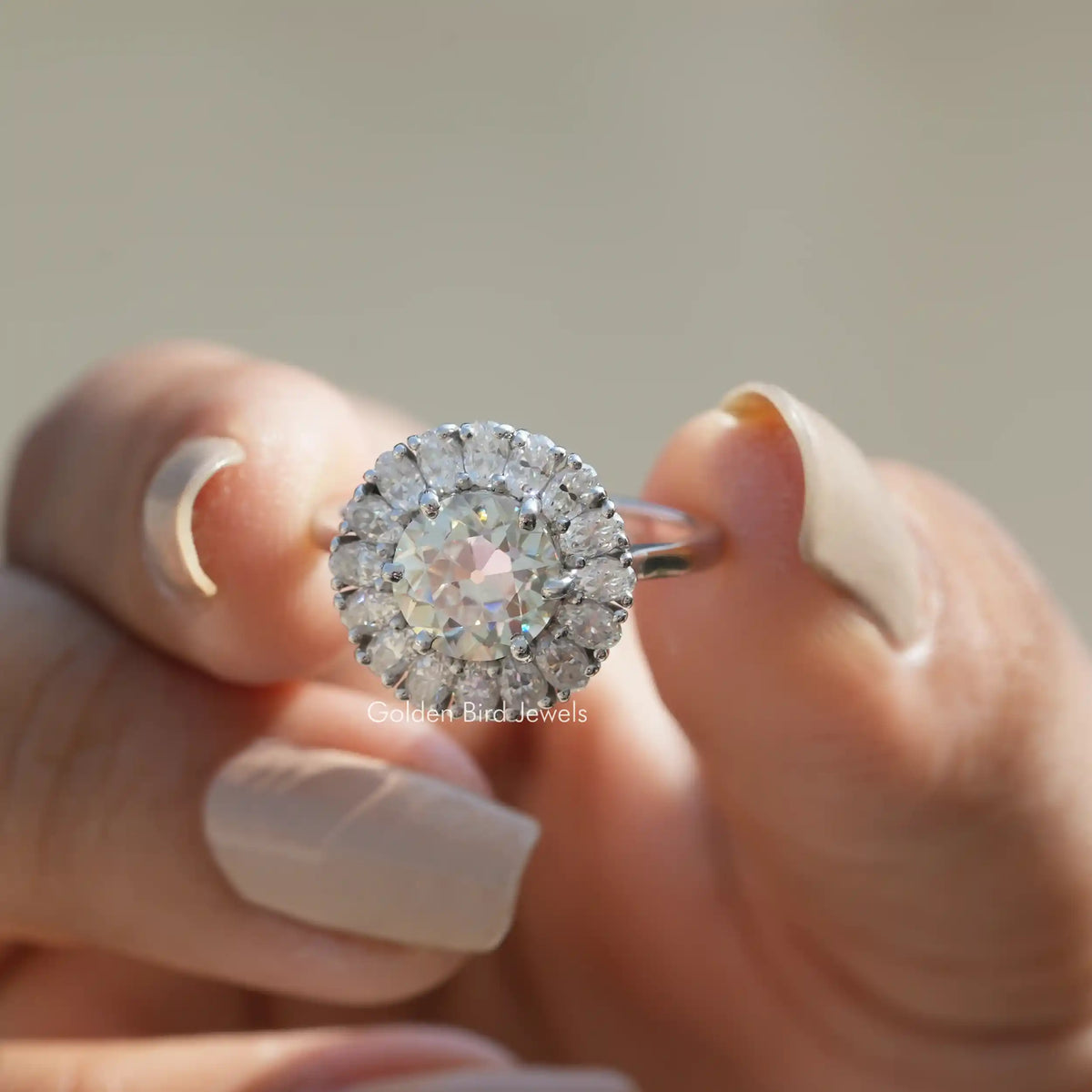 Front View of Old European Round Cut Moissanite Ring In Two Fingers