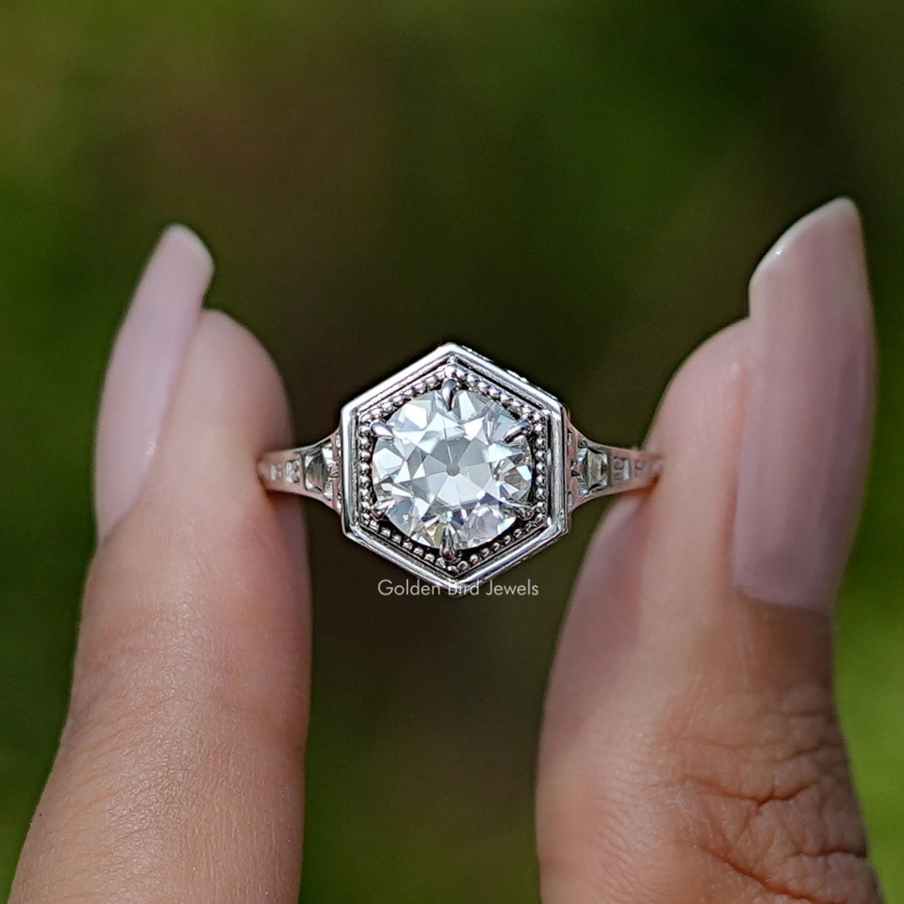 Front View of Old European Round Cut Moissanite Ring In two Fingers