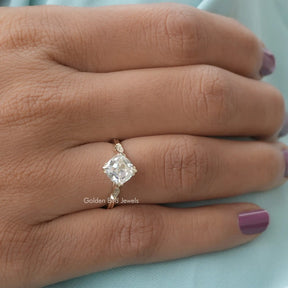 Close-Up View of Cushion And Round Cut Moissanite Ring In Yellow Gold