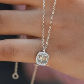 In hand showing view of moissanite pendant	 		