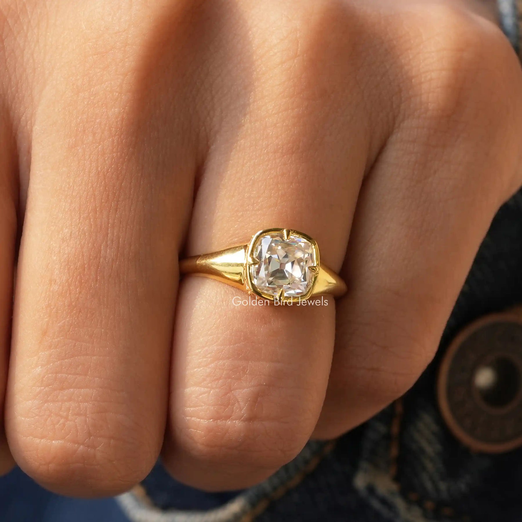 View of Cushion Cut Moissanite Solitaire Ring In Yellow Gold