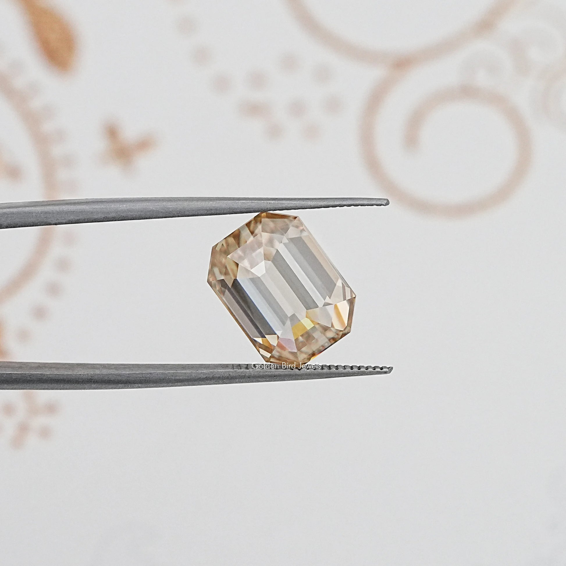 In Tweezer View Of Old Mine Emerald Cut Loose Moissanite Stone