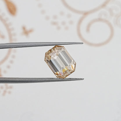 In Tweezer View Of Old Mine Emerald Cut Loose Moissanite Stone
