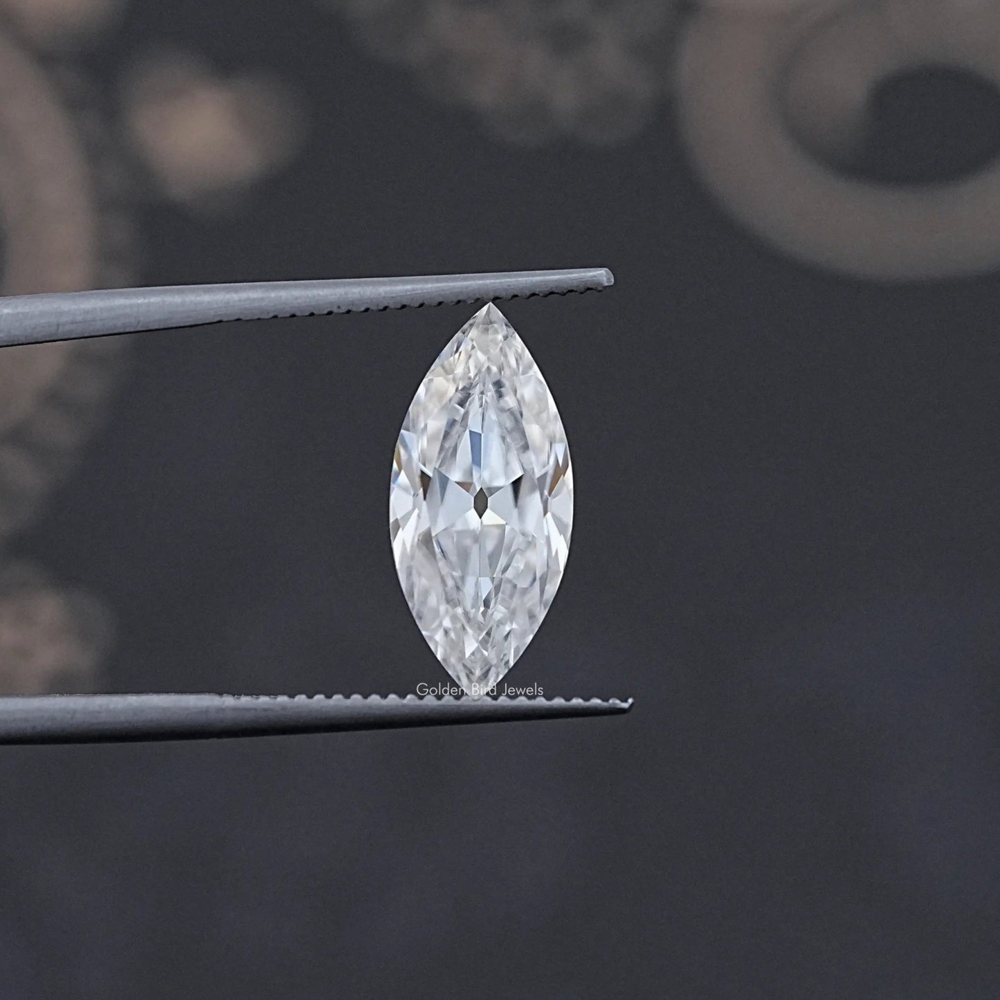 In Tweezer View Of Old Mine Marquise Cut Moissanite Loose Stone