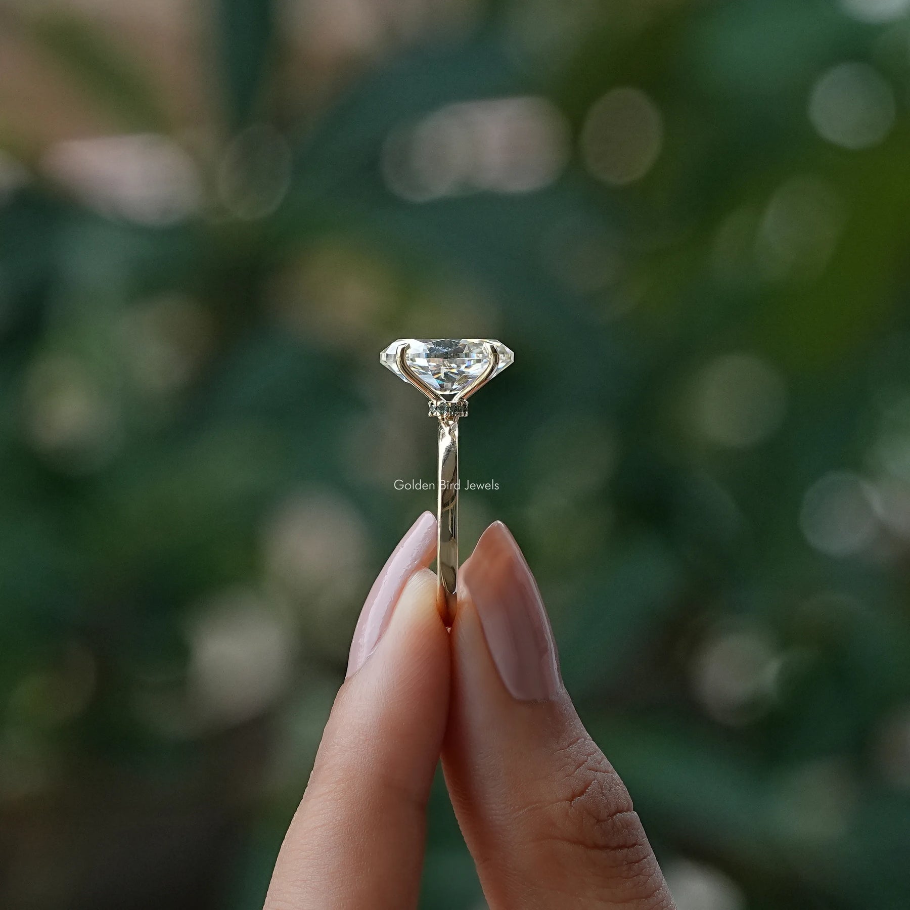 Side View of Old Mine Marquise Moissanite Solitaire Ring In two fingers