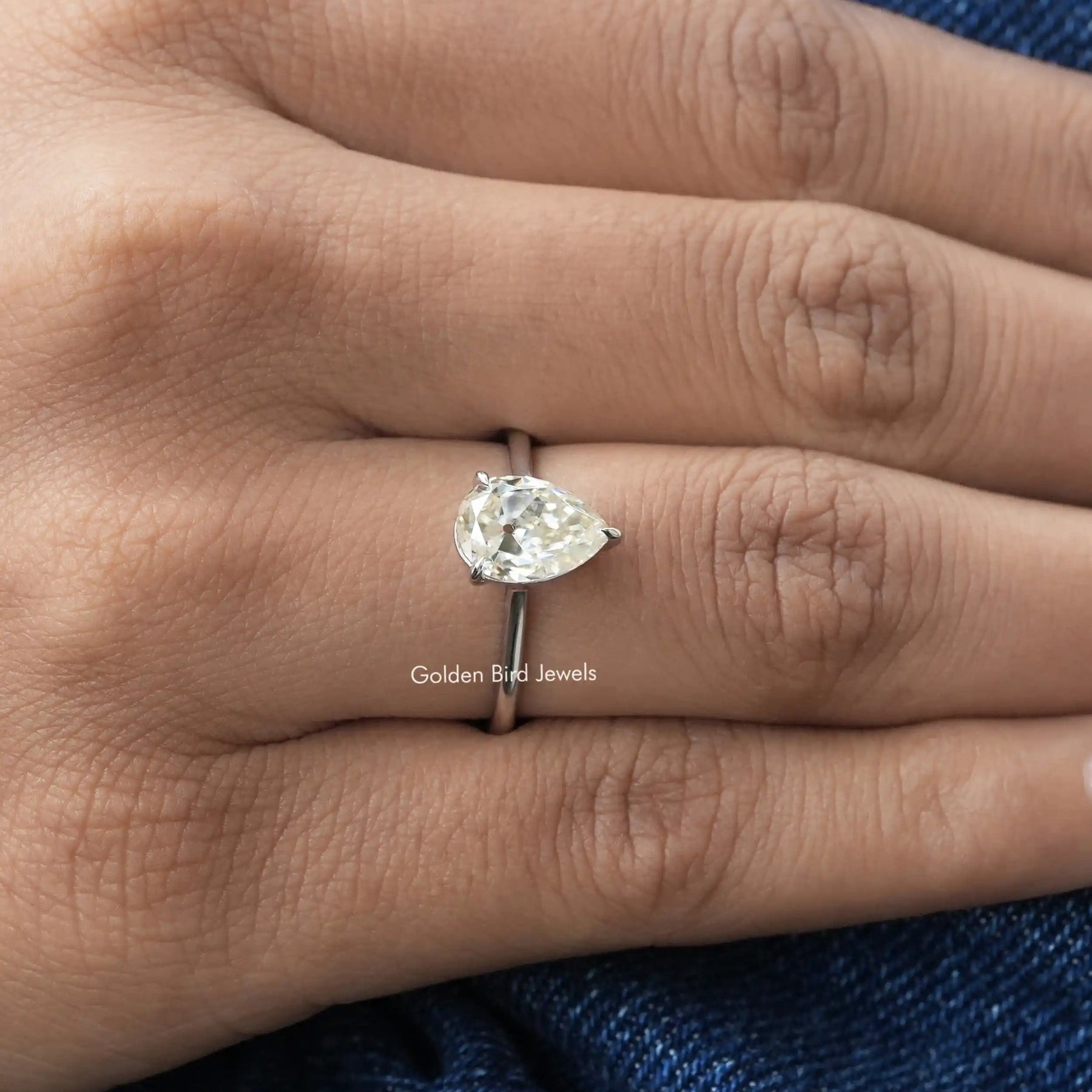 View of Old Mine Pear Cut Moissanite Ring In finger