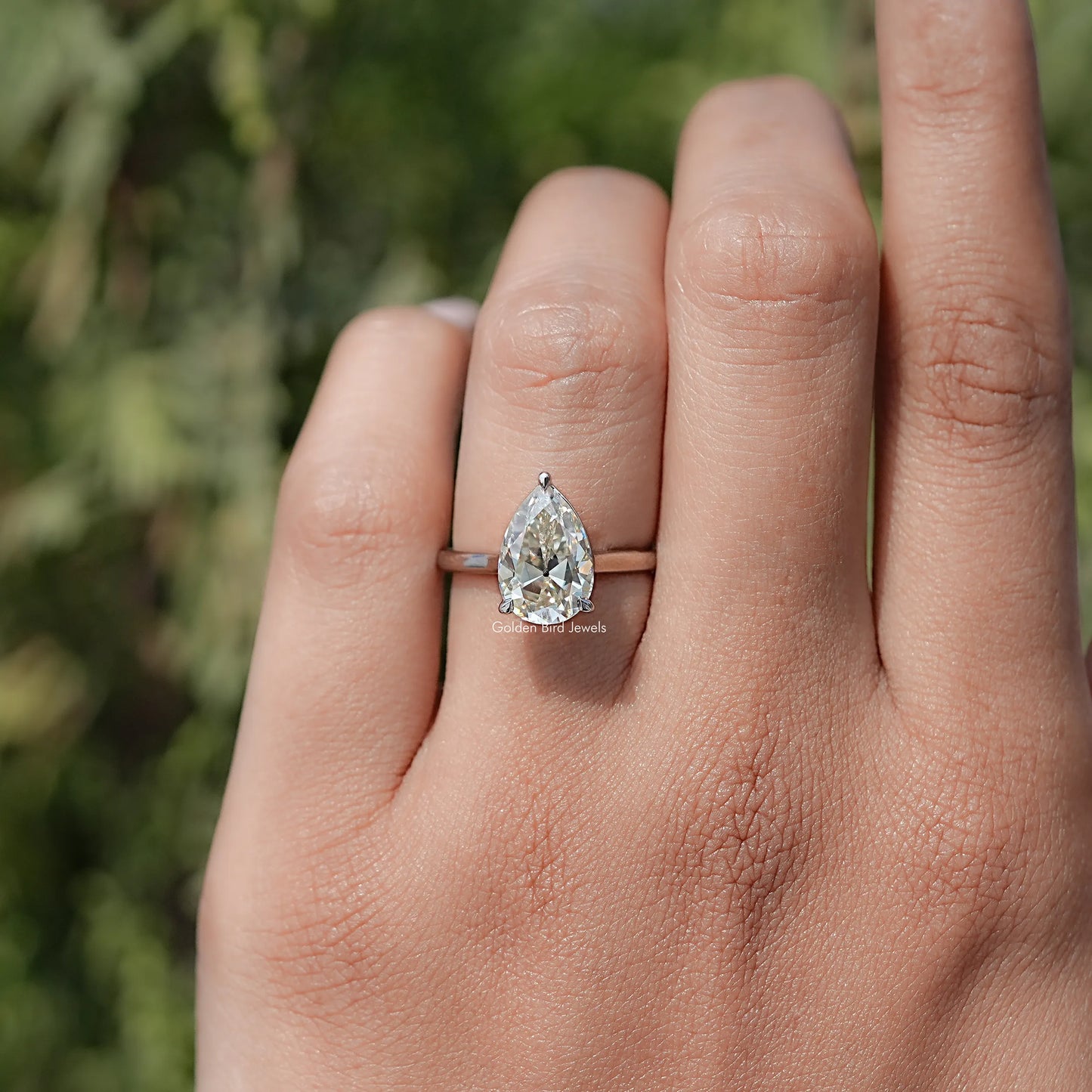 In finger front view of Halo Moissanite Engagement Ring  