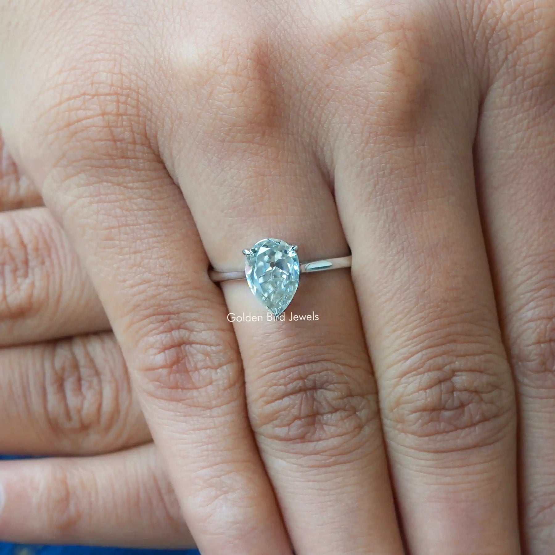 Close-Up View of Pear Cut Moissanite Ring In White Gold