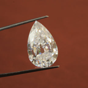 In Tweezer View Of Colorless Old Mine Pear Shaped Loose Stone