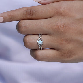 View of Round Cut Gemstone Infinity Ring In White Gold