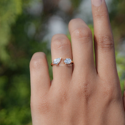 In finger view of Pear And Oval Shape Lab Diamond Halo Ring

