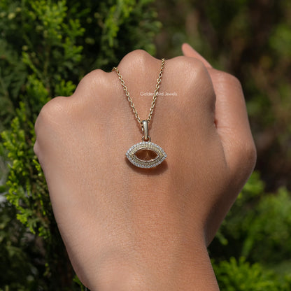 In hand showing a view of moissanite pendant