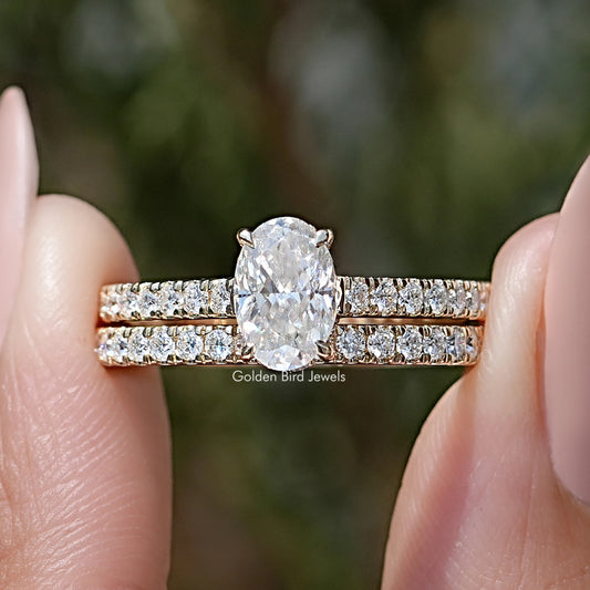 Oval-cut moissanite wedding ring set with pavé bands
