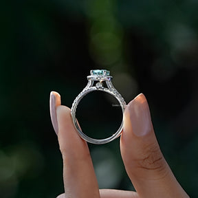Back View A Oval And Round Cut Bridal Ring Set  in two fingers