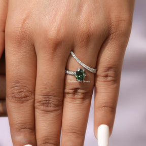 Detailed View Of Green Oval Cut Accent Stone Ring In White Gold