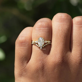 Close-Up View of Oval And Pear Cut Ring Set In Yellow Gold
