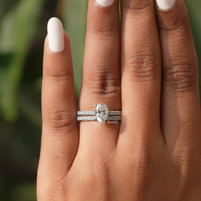 View of Oval Cut Moissanite Bridal Ring Set In finger