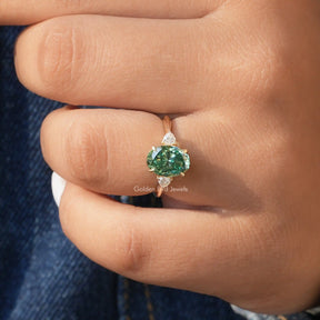 Detailed View Of Three Stone Oval Cut Engagement Ring In Yellow Gold