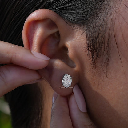 Close view of oval shaped earrings in a Unique design