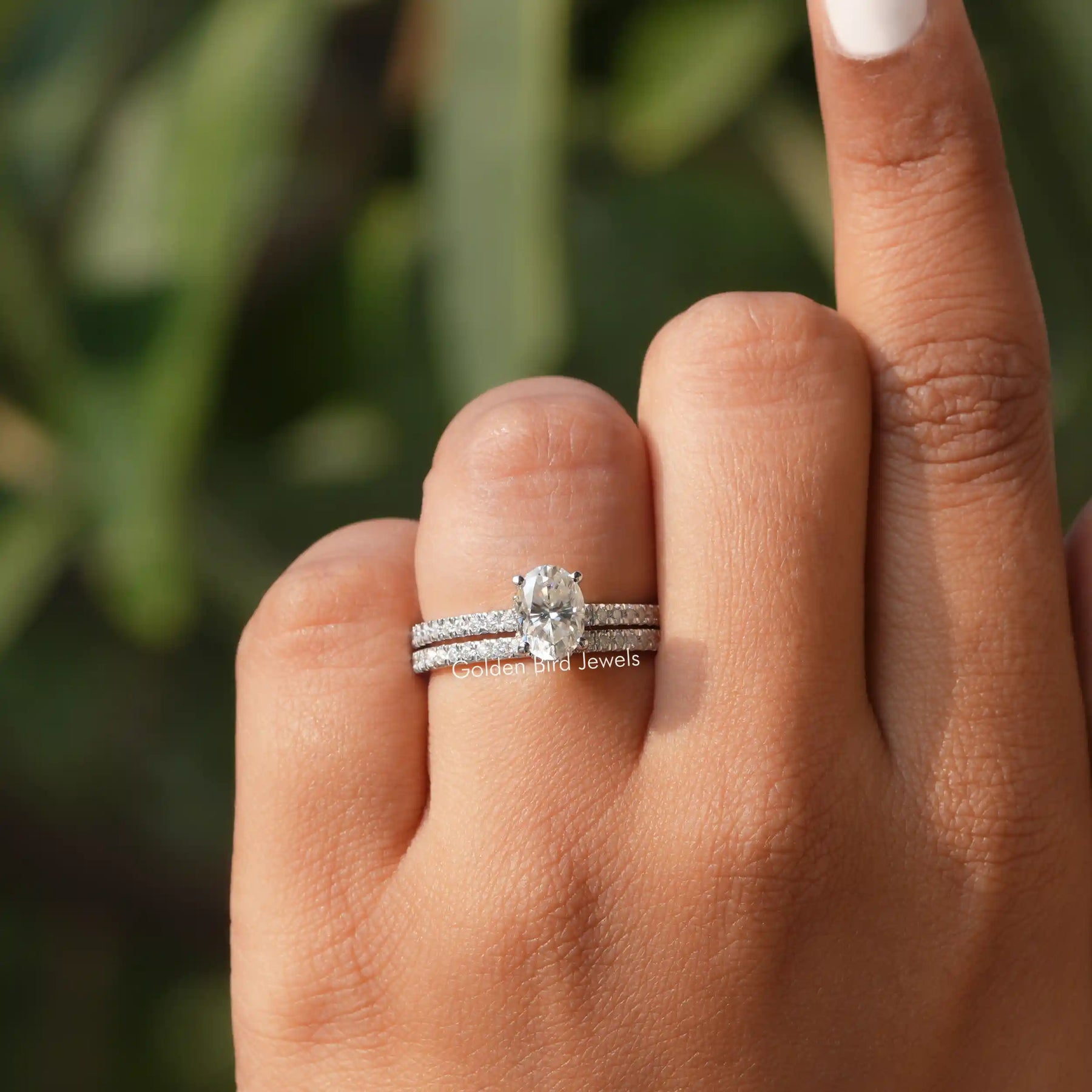 View of Oval And Round Cut Moissanite Ring In finger