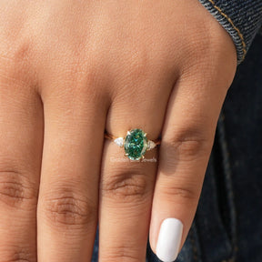 Close-Up View of Moissanite Oval And Trangle Cut 3 Stone Ring In Yellow Gold