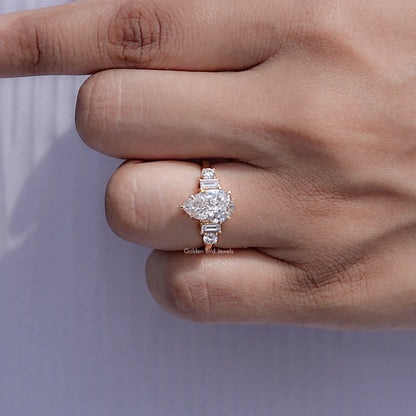 Detailed view of Pear And Baguette Cut Diamond Five Stone Ring