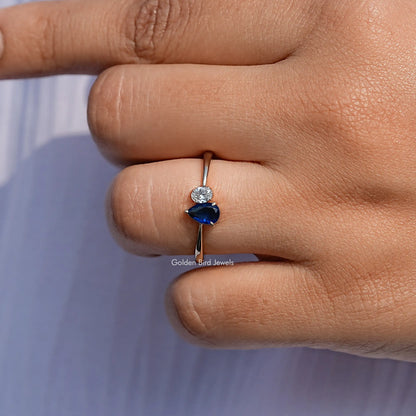 Close View Of Blue Pear Cut Halo Engagement Ring

