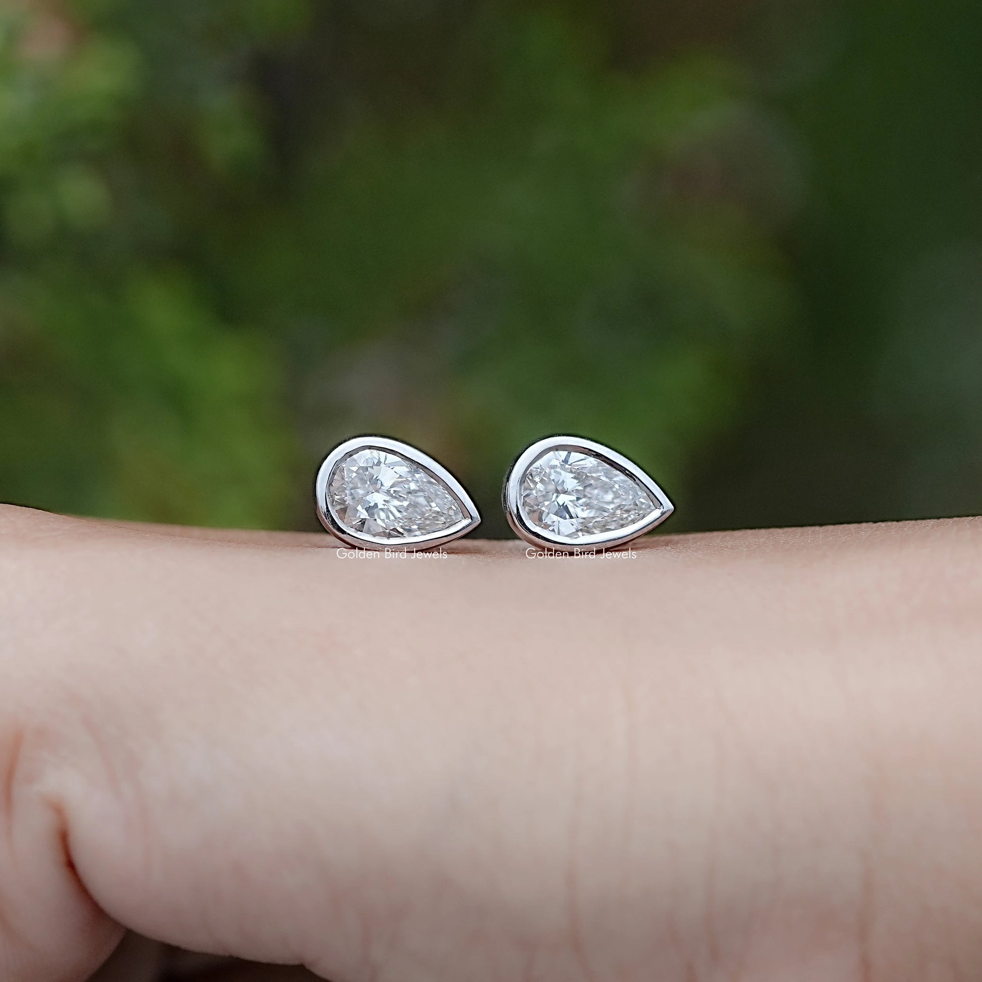 Front view of Lab Diamond Pear Shaped Bezel Set Stud Earrings