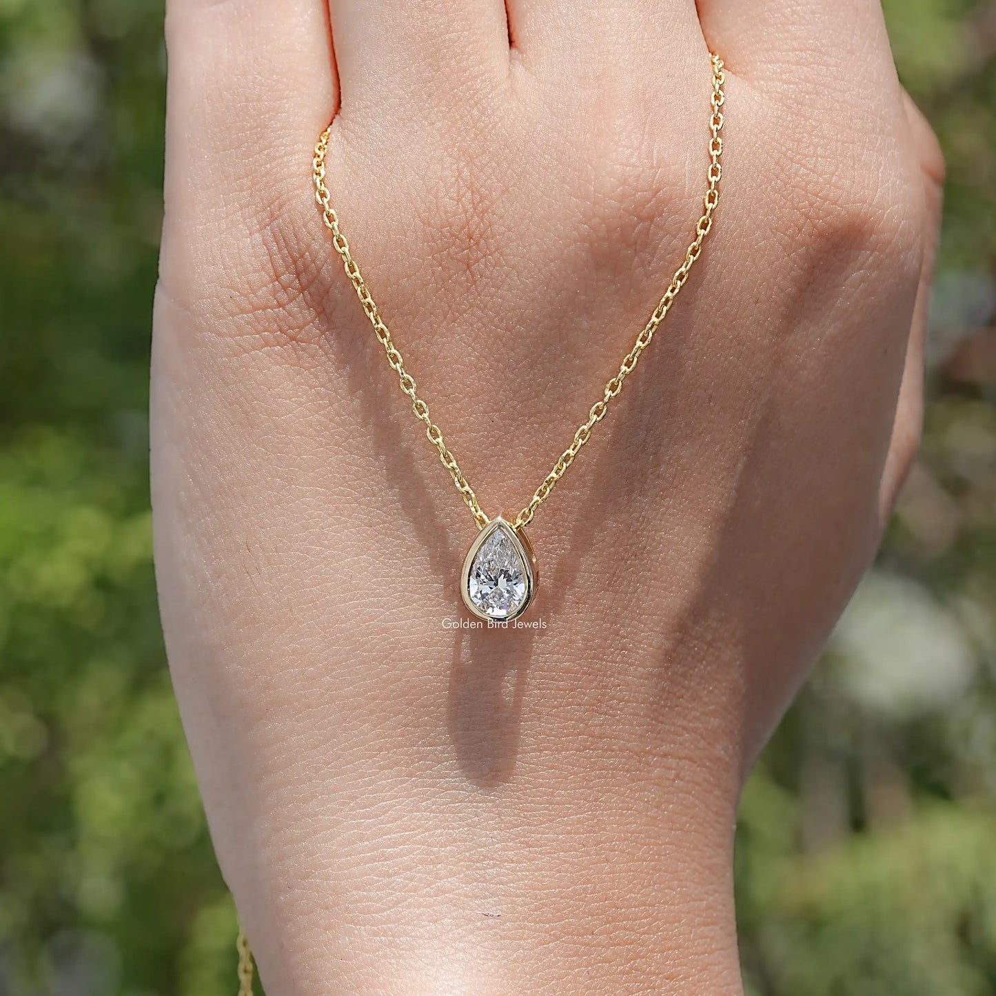 hand Showing View of Pear Cut Lab Diamond Pendant