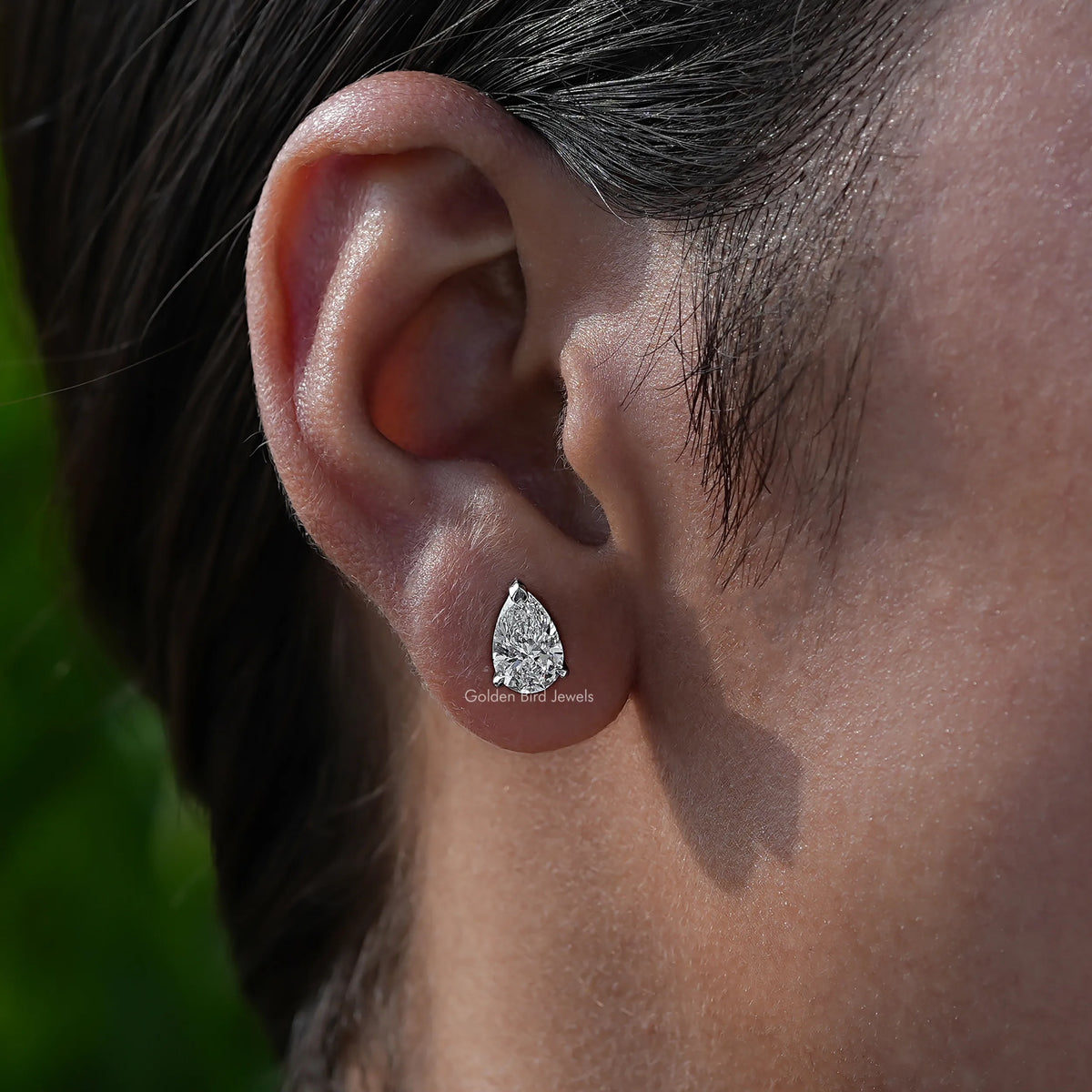 In-Ear View Of Four Prong Set pear Cut Stud Earrings