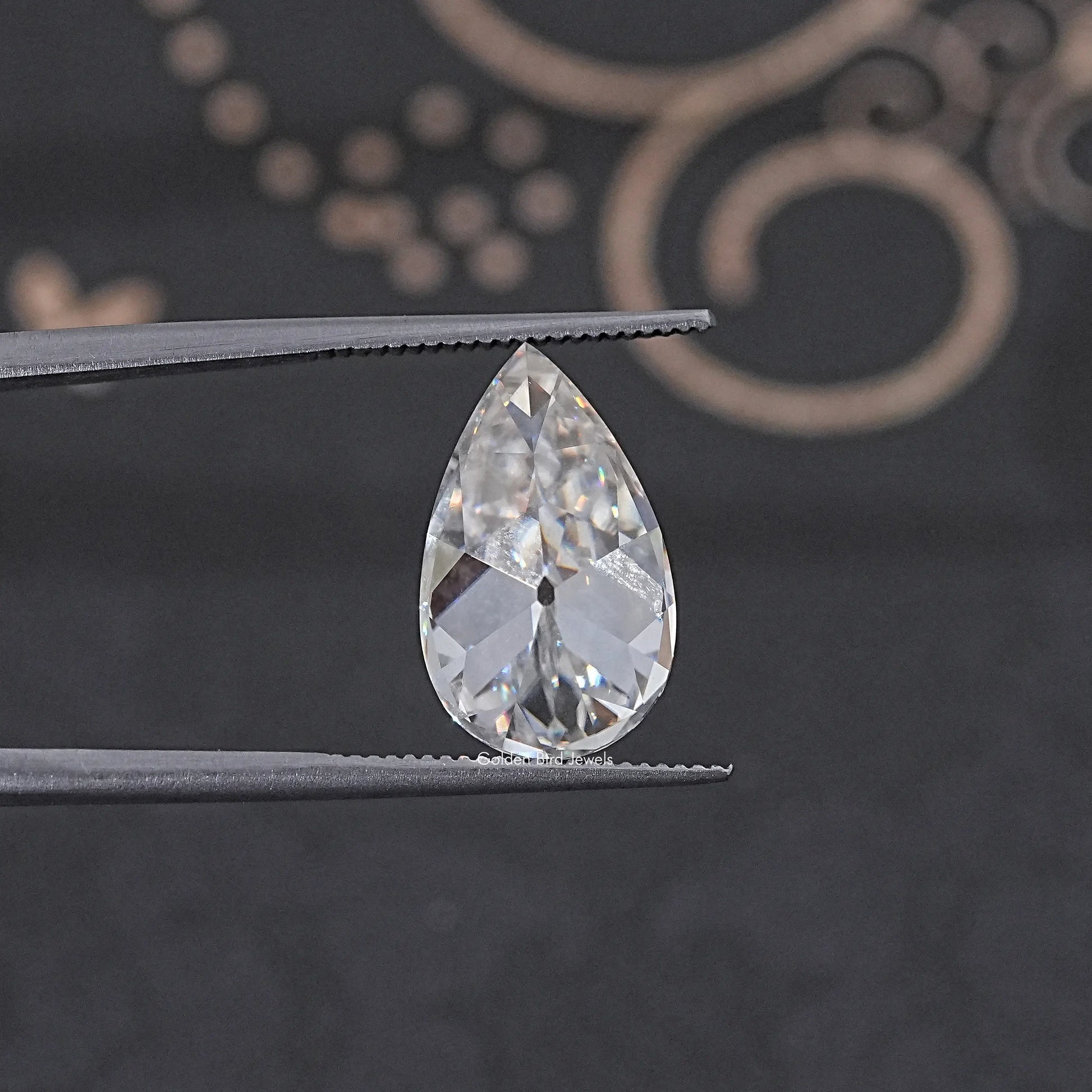 In Tweezer View Of Old Mine Pear Cut Loose Moissanite Stone