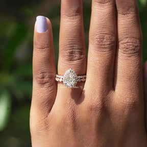 View of Pear Cut Moissanite Halo Bridal Ring Set In finger