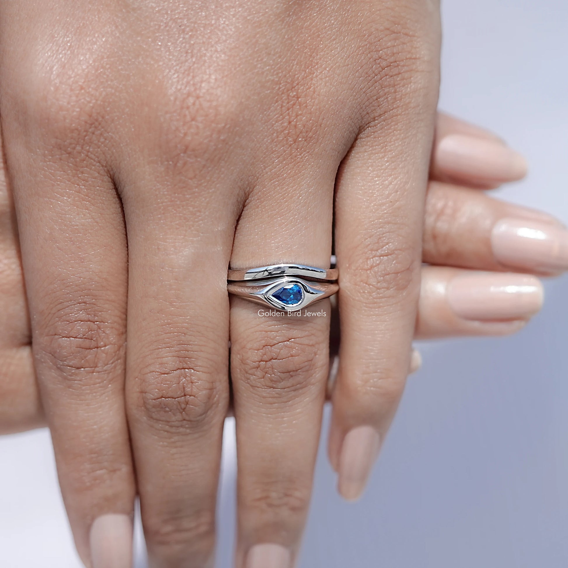 View of Pear Shaped Solitaire Moissanite Ring in prongs setting 