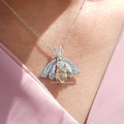 In neck view of Pear cut statement moissanite halo pendant 
