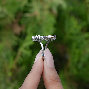 Side View of Pear Gemstone Flower Shape Cluster Bypass Ring In two fingers