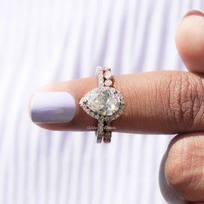 In finger front View of Moissanite Pear Cut Bridal Ring Set In White Gold