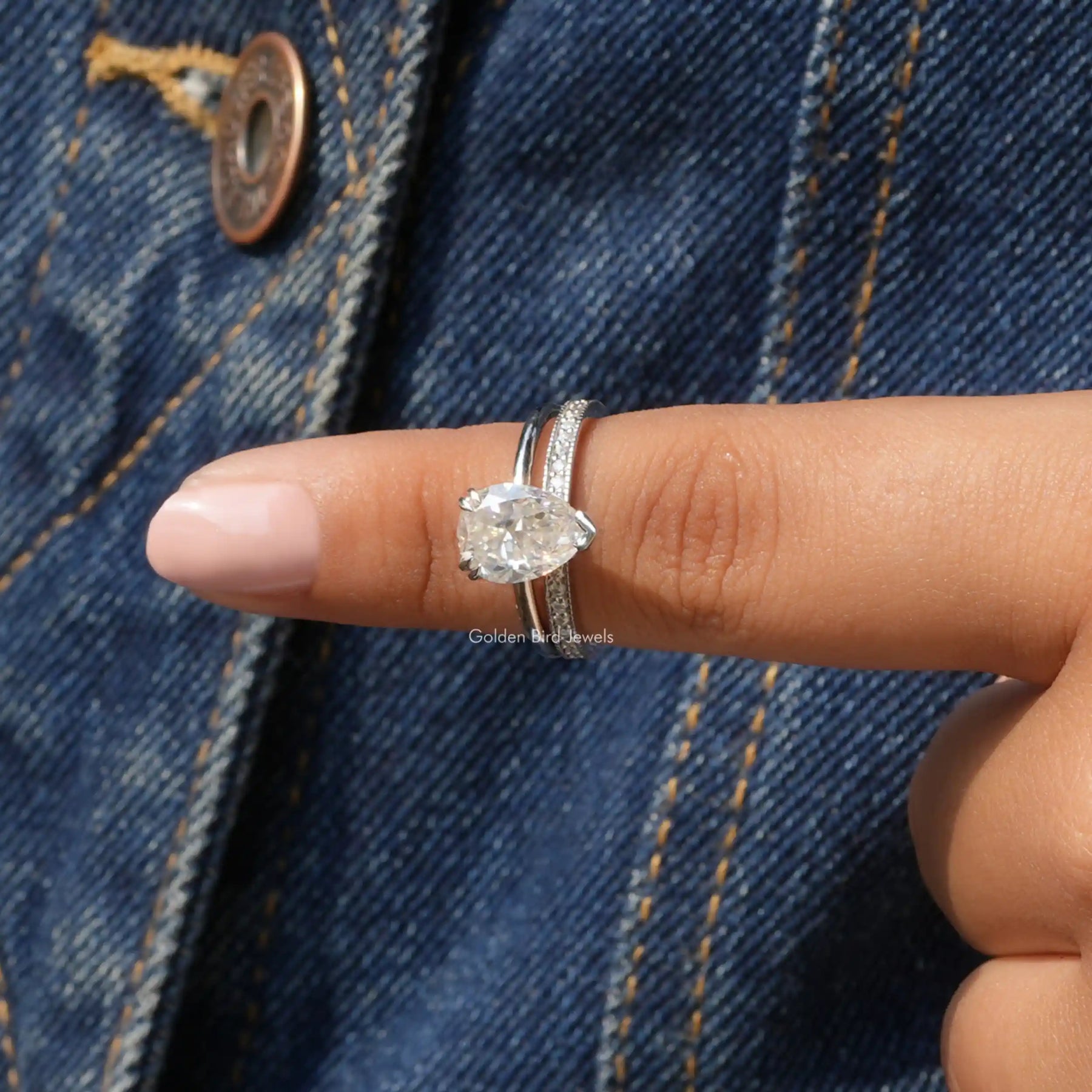 In finger front View of Pear Cut Moissanite Ring Set