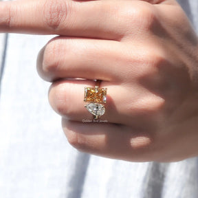 Finger view of Fancy Colored Pear And Radiant Cut Two Stone Ring 