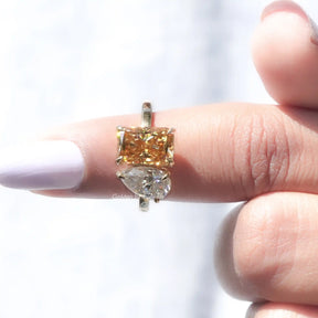 close up view of Colorless Pear And Champagne Radiant Cut Toi et Moi Ring 